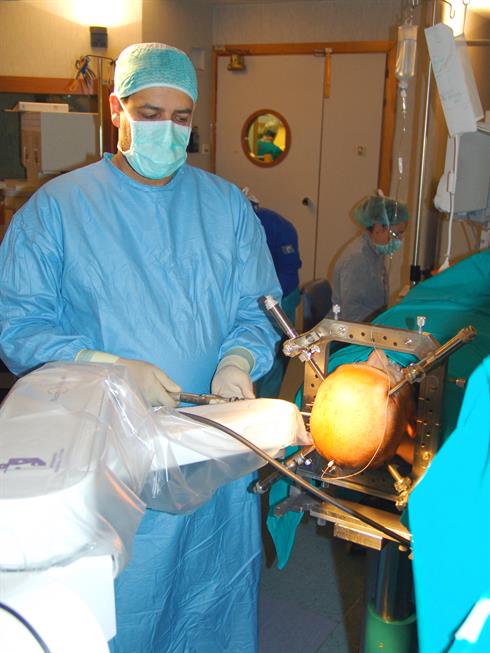 Dr Cardinale using the neuromate robot during an SEEG procedure